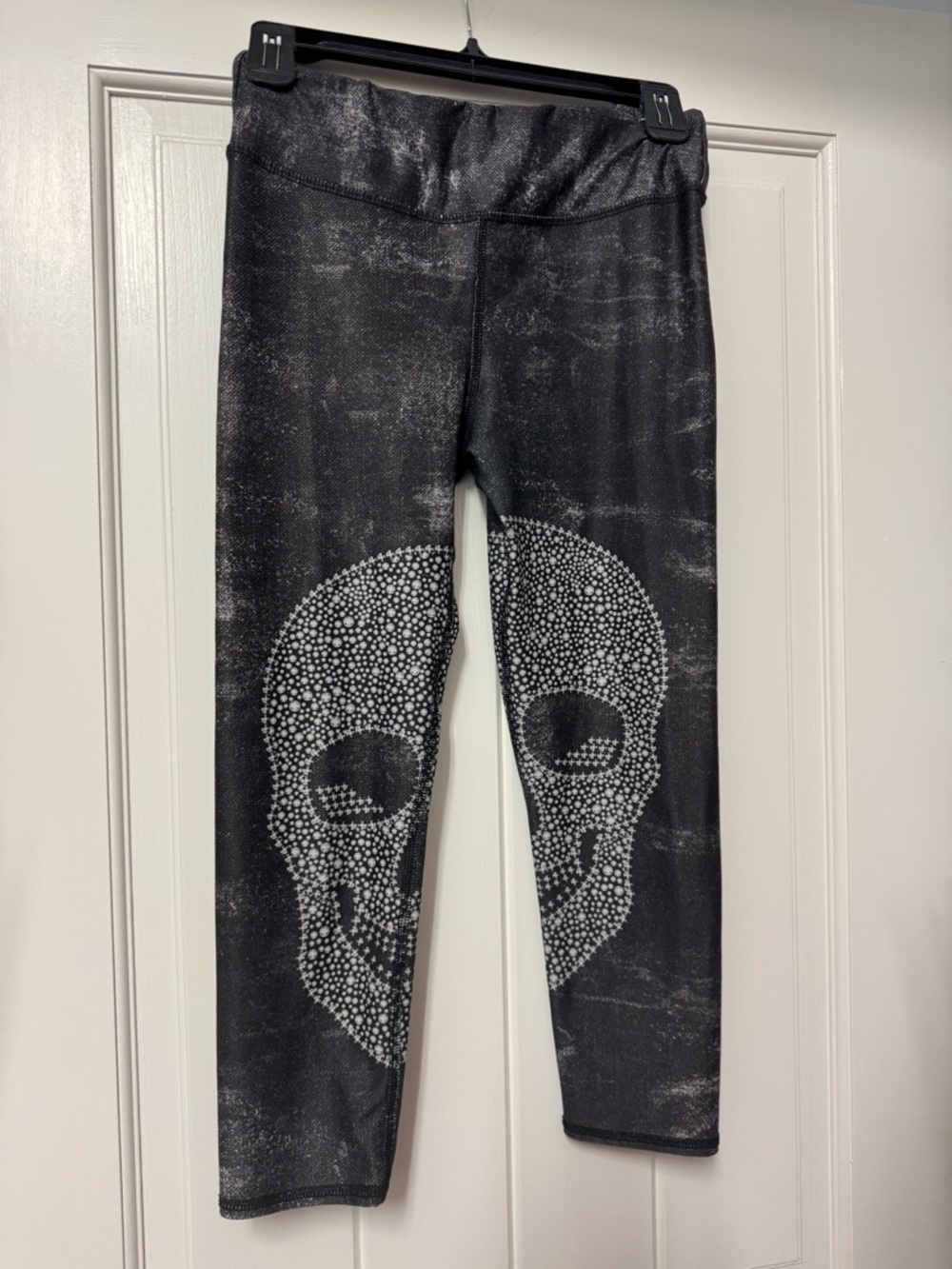 Evolution and Creation Black Leggings with Silver Skull Design